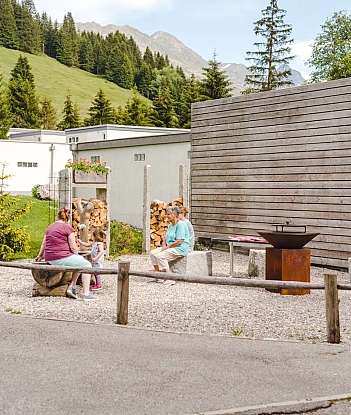 A family enjoys time together in a scenic outdoor space.